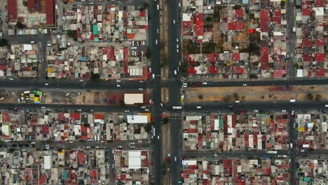 Bird's-eye-automobiles-moving-in-suburban-street-in-Mexico-City