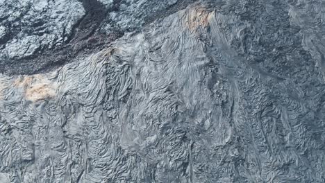 Field-of-cold-magma-in-Hawaii-landscape,-aerial-drone-view