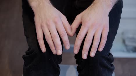 Stressed-man-with-shaking-and-restless-hands,-close-up