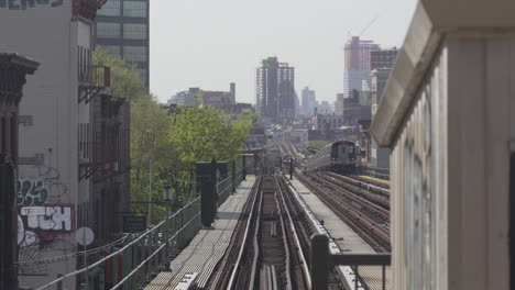 Subways-on-Elevated-platform-from-afar-pulling-In-Station