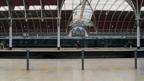 Empty-train-arriving-at-Paddington-Train-Station-during-Coronavirus-Covid-19-lockdown-in-London-when-public-transport-and-travel-was-quiet-and-deserted-with-no-people-in-England,-Europe