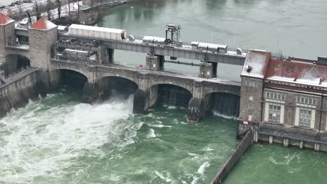Water-streaming-through-Laufenburg-hydro-power-plant-in-winter-time-during-high-water