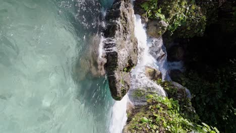 Rio-San-Rafael,-vertical-dolly-forward-to-scenic-exotic-waterfall,-summer