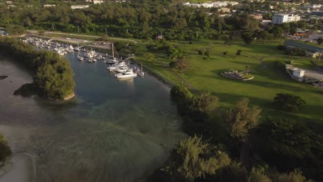 Aerial-view-of-parked-yachts-at-American-Memorial-Park-during-golden-hour