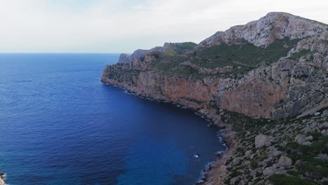 Rocky-Cliffs-Coastline,-Green-Forest-And-Sea,-Aerial-Drone-Footage-Of-A-Mallorca
