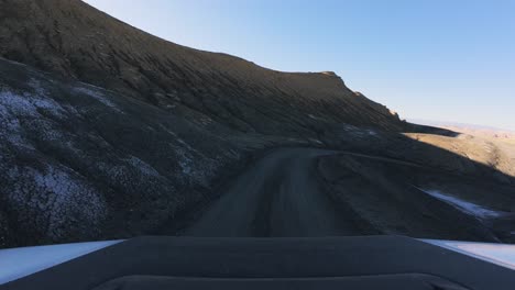 POV-Driving-SUV-from-Moonscape-Overlook-to-Factory-Butte-Road,-Utah-Landscape