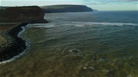 Drone-Shot-Flying-Past-Staithes-up-the-Coast-of-Cliffs-Towards-Saltburn
