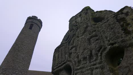 High-cross-Round-tower-historic-village-special-place-tourist-attraction-Castledermot-Kildare-Ireland-in-winter