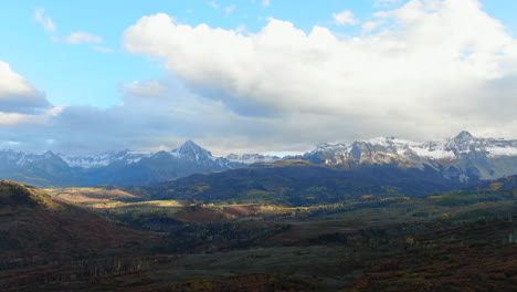 Mount-Sniffels-Wilderness-Colorful-Colorado-Million-Dollar-Highway-Dallas-Range-aerial-cinematic-drone-cloudy-autumn-fall-colors-San-Juans-Ridgway-Ralph-Lauren-Ranch-14er-backward-down-reveal-motion