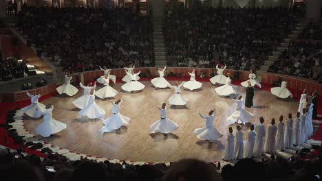 Men-Dance-in-Circles-Sufi-Whirling-Performance-physically-active-meditation-Sufi-Tradition-in-White-Clothes,-Slow-Motion-Shot,-Seb-i-Arus-Ritual