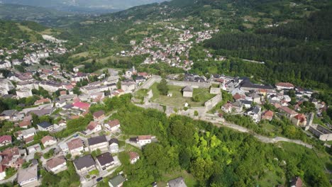 Walled-city-of-Jajce-fortress,-aerial,-circle-pan,-Bosnia-and-Herzegovina