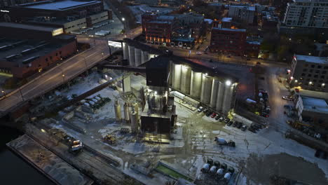Fixed-aerial-view-of-the-Illuminated-Ozinga-Concrete-facility,-in-Chicago,-USA