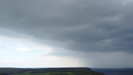 Aerial-Dolly-in-Shot-Dark-Clouds-Covering-Lake-Huron-in-Bruce-Peninsula