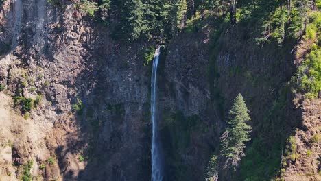 Waterfall-Flowing-off-Mountainside-on-West-Coast
