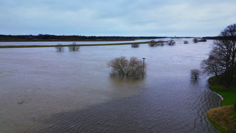 High-water-level-in-river-Meuse-Dutch-winter-Limburg-landscape-shot