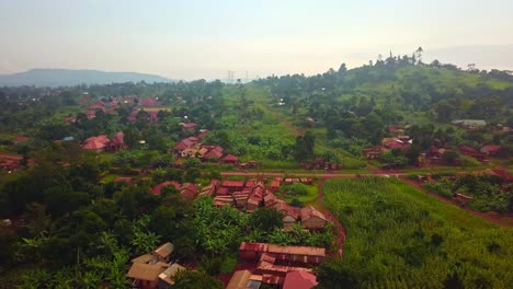 Countryside-Landscape-With-Road-And-Houses-In-Jinja,-Uganda---Aerial-Shot