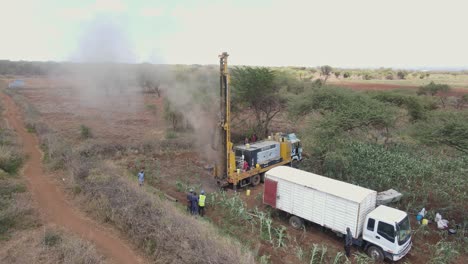 Solving-problem-with-fresh-water-in-Kenya,-drilling-borehole-well-on-African-farmland