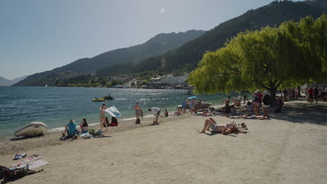 People-Under-The-Sun-At-Queenstown-Bay-Beach-In-New-Zealand