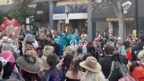 A-large-crowd-is-dancing-in-Ashland,-Oregon's-Halloween-parade