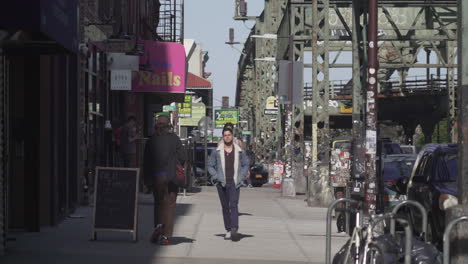 Long-Shot-of-Pedestrian-walking-in-Brooklyn-Street-Rack-Focus