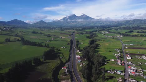 Illinizasa-volcano-peak-from-Panamericana-highway-E-35-Chaupi-Ecuador-drone-view