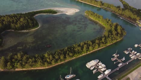 Tilt-up-drone-shot-of-yacht-port-and-fishing-bay-at-American-Memorial-Park,-Saipan