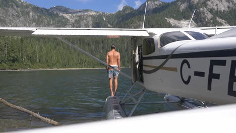 A-Man-Leaping-Into-the-Water-From-a-Seaplane---Close-Up