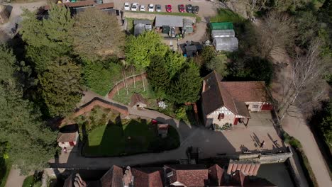 Aerial-Flyover-and-Reveal-of-Igtham-Mote,-showing-the-Garden-and-Estate