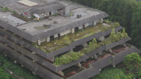 Aerial-telephoto-shot-of-Monte-palace-abandoned-hotel-at-São-Miguel-island,-Azores