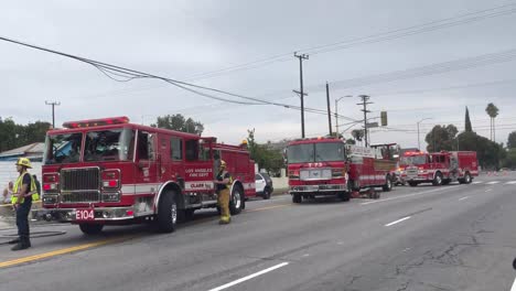 Fire-trucks-park-on-street-with-red-flashing-lights