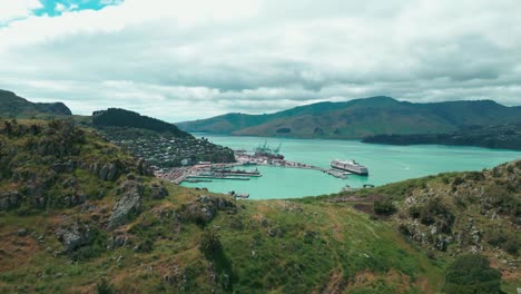 Cass-Bay-New-Zealand-Drone-reveal-through-mountian-tops