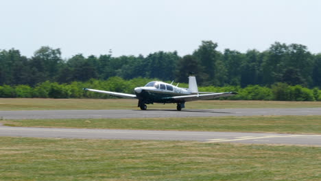 Mooney-M20-recreational-aircraft-taking-off-from-Zwartberg-airfield-in-Belgium