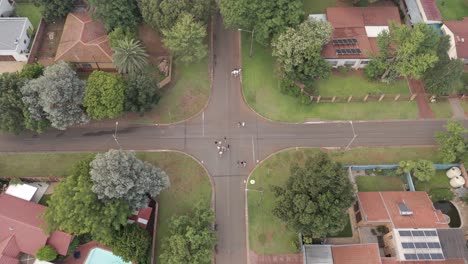 Bird's-eye-view-of-people-walking-down-a-street-in-a-quiet-residential-area-of-Centurion