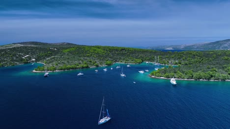 The-drone-is-flying-above-the-sea-with-lots-of-boats-anchords-near-the-shore-in-Croatia-Aerial-Footage-4K