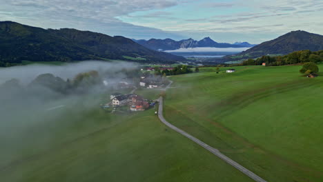 Aerial-deep-misty-fog-valley-wonderful-nature-landscape,-mountain-background-natural-village
