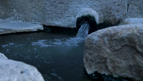 Boiling-hot-water-bubbles-out-of-natural-spring-piping-in-Spain