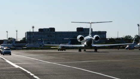 Luxury-Private-Jet-taxiing-at-airport-apron-in-Chișinău-airport,-static