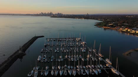 Drone-footage-flying-over-boats-docked-in-Brighton-Beach-in-Melbourne,-Australia