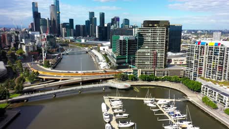 Drone-footage-of-Yarra-Edge-Marina,-where-yachts-are-docked-at-this-picturesque-waterfront