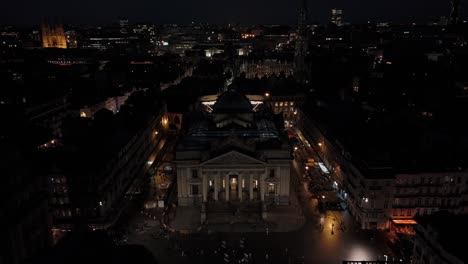 Aerial-Drone-Above-Brussels-Belgium-City-at-Night-Grand-Place-at-Bourse-Square