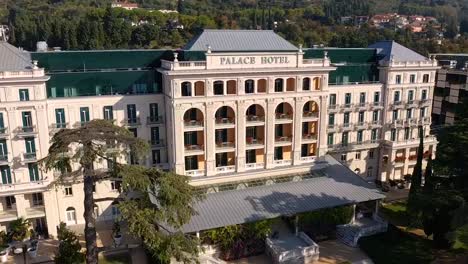 Forward-flying-aerial-drone-view-of-Trieste-Kempinski-palace-hotel-area,-Italy