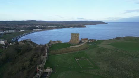 Aerial-top-shot-of-Scarborough-castle-during-evening-in-Scarborough-North-Yorkshire,-UK