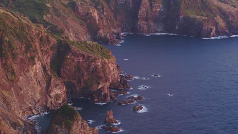 Aerial-telephoto-shot-of-rough-coastline-in-Flores-Azores-during-sunset