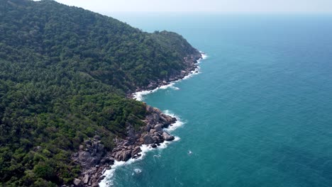 Rocky-cliffs,-Mango-Bay-,-Ko-Tao,-dramatic-spectacle,-rising-above-ocean-water