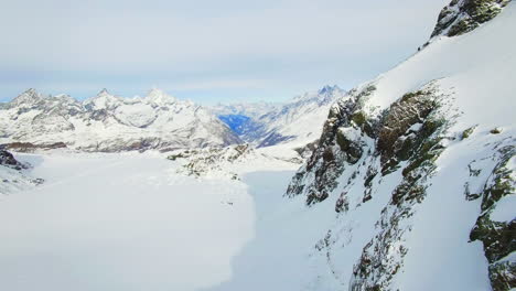 Embark-on-a-breathtaking-drone-journey-above-Zermatt's-snow-kissed-terrain