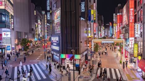 Wide-Shot-Night-Time-Lapse-of-Traffic,-Pedestrians,-neon-signs-and-lights-in-Downtown-Tokyo-Musashino-Street-In-Shinjuku,-Japan