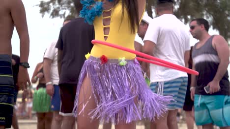 Woman-Dancing-with-Hula-Hoop-and-Festive-Summer-Clothes,-Slowmotion