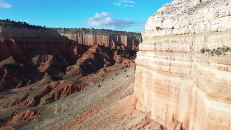 Aerial-flying-along-the-towering-cliff-face-into-the-Red-Canyon-of-Teruel