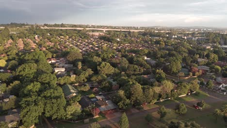Rising-panoramic-drone-view-over-the-area-with-townhouses-in-Centurion,-South-Africa