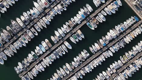 Aerial-Drone-Closeup-Zoom-Into-Sailing-Boats-Docked-at-Blue-Bay-Port-360-Shot-Establishing